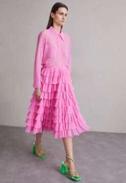 Norma Kamali Ruffle Skirt - A-Line Skirt -Pieces Shop 55473ccb32c649a5864a492eeb271a2b