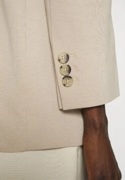 Melfi - Short Coat - Beige -Pieces Shop abf994ed2142447c82294e669bd2e35a