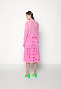 Norma Kamali Ruffle Skirt - A-Line Skirt -Pieces Shop ad6610c0959c44a8aff92d0f7f63581f