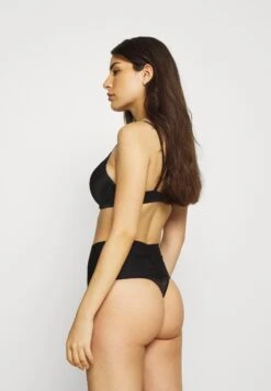 Maidenform Tame Your Tummy Shaping Thong Firm Control - Shapewear - Black -Pieces Shop c0c586e4356e4028b5966876d14ea46b